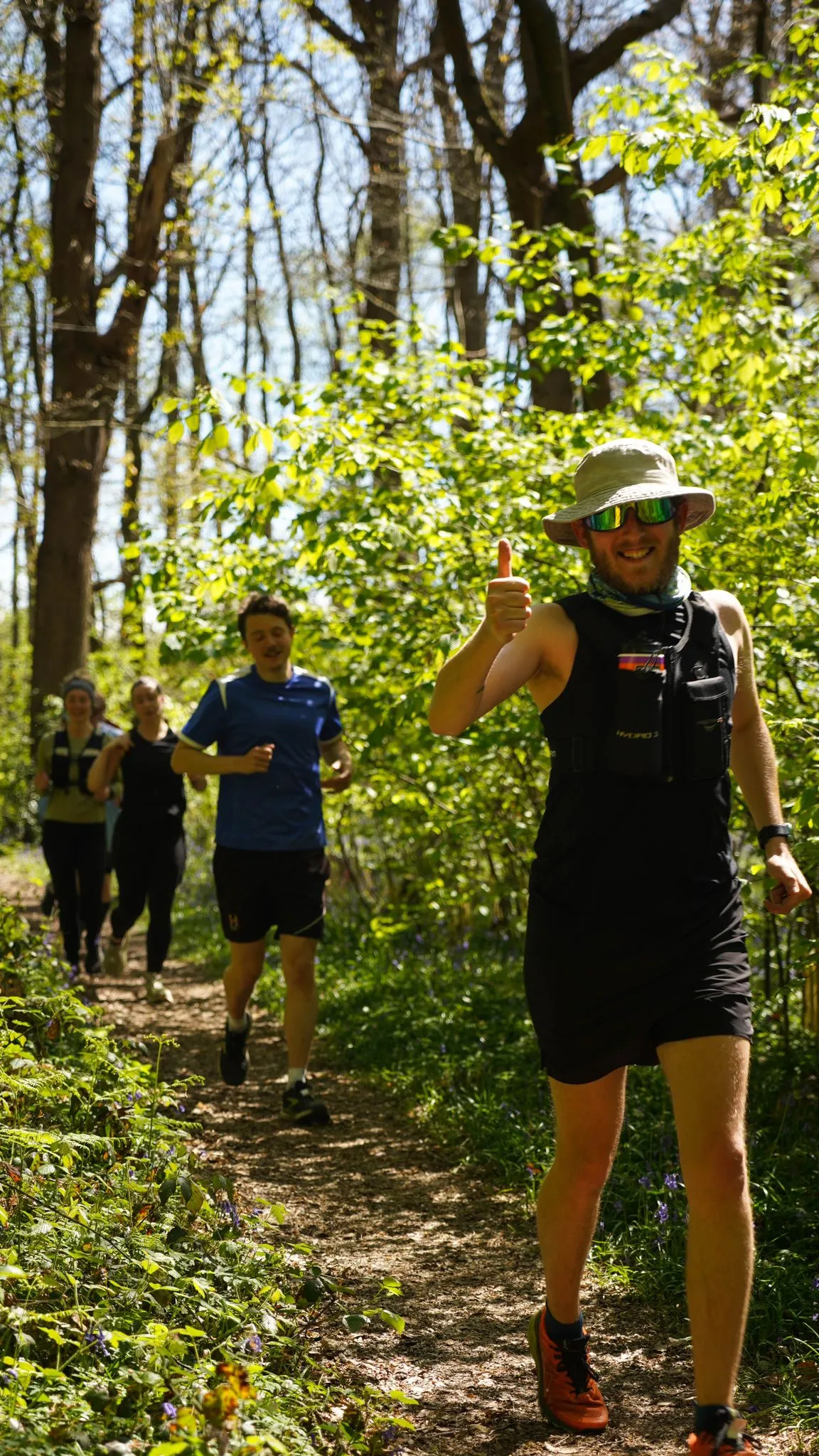A runner on the bluebell woodland trail at Backyard Egg