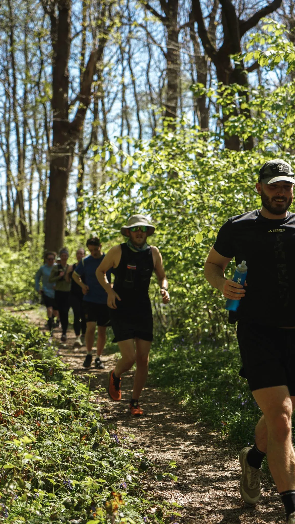 A runner on the bluebell woodland trail at Backyard Egg