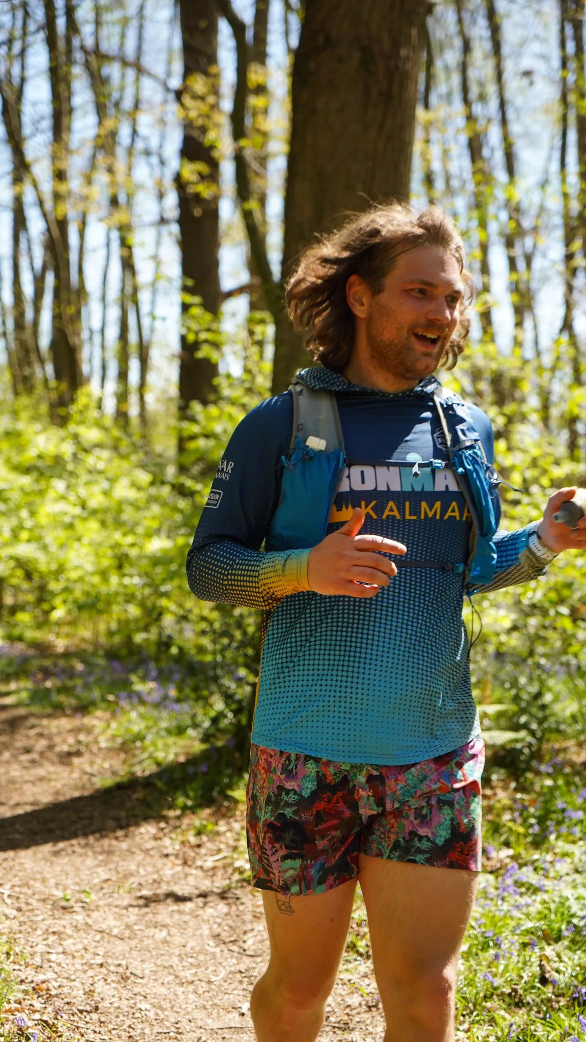 A runner on the bluebell woodland trail at Backyard Egg