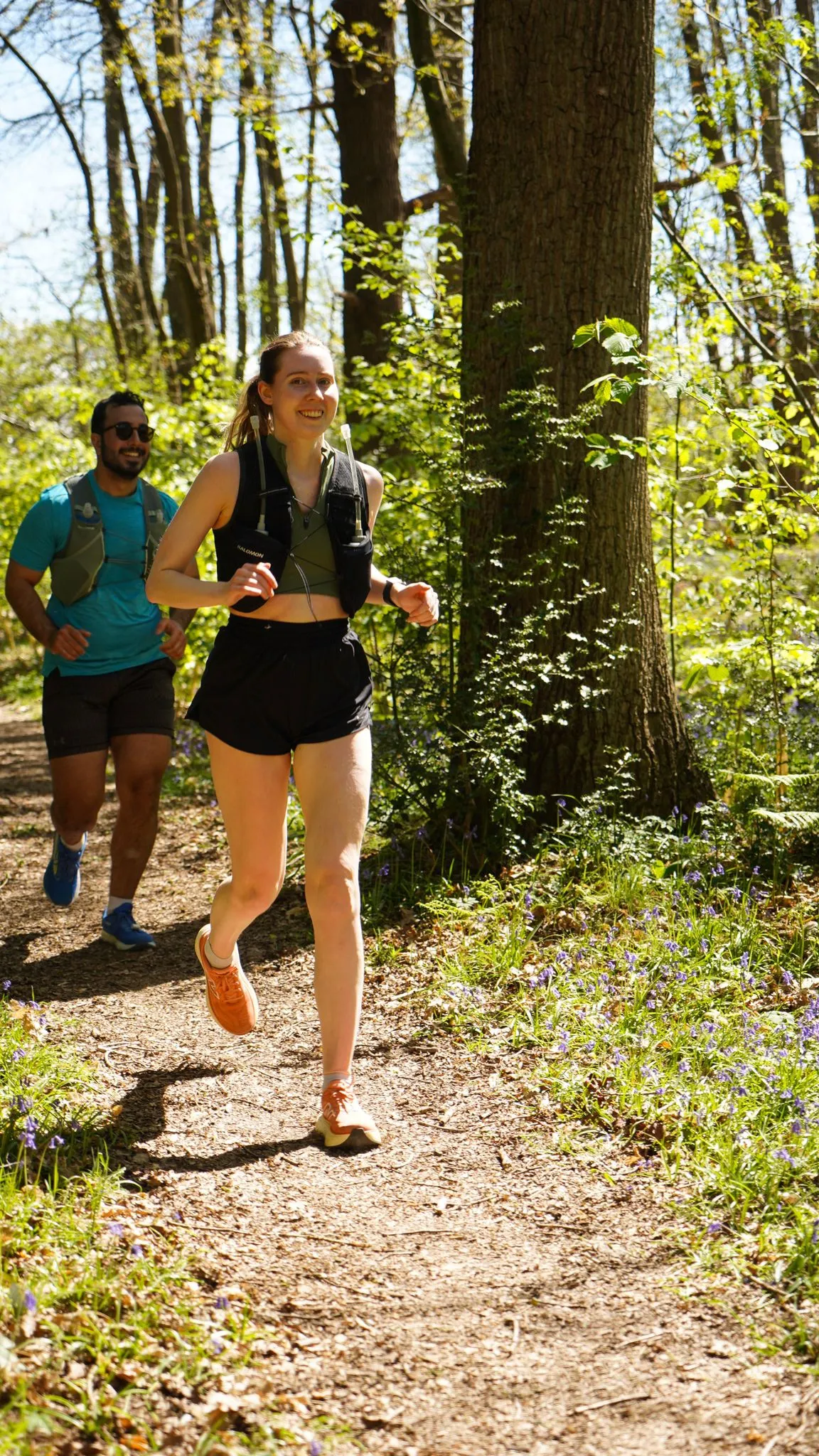 A runner on the bluebell woodland trail at Backyard Egg