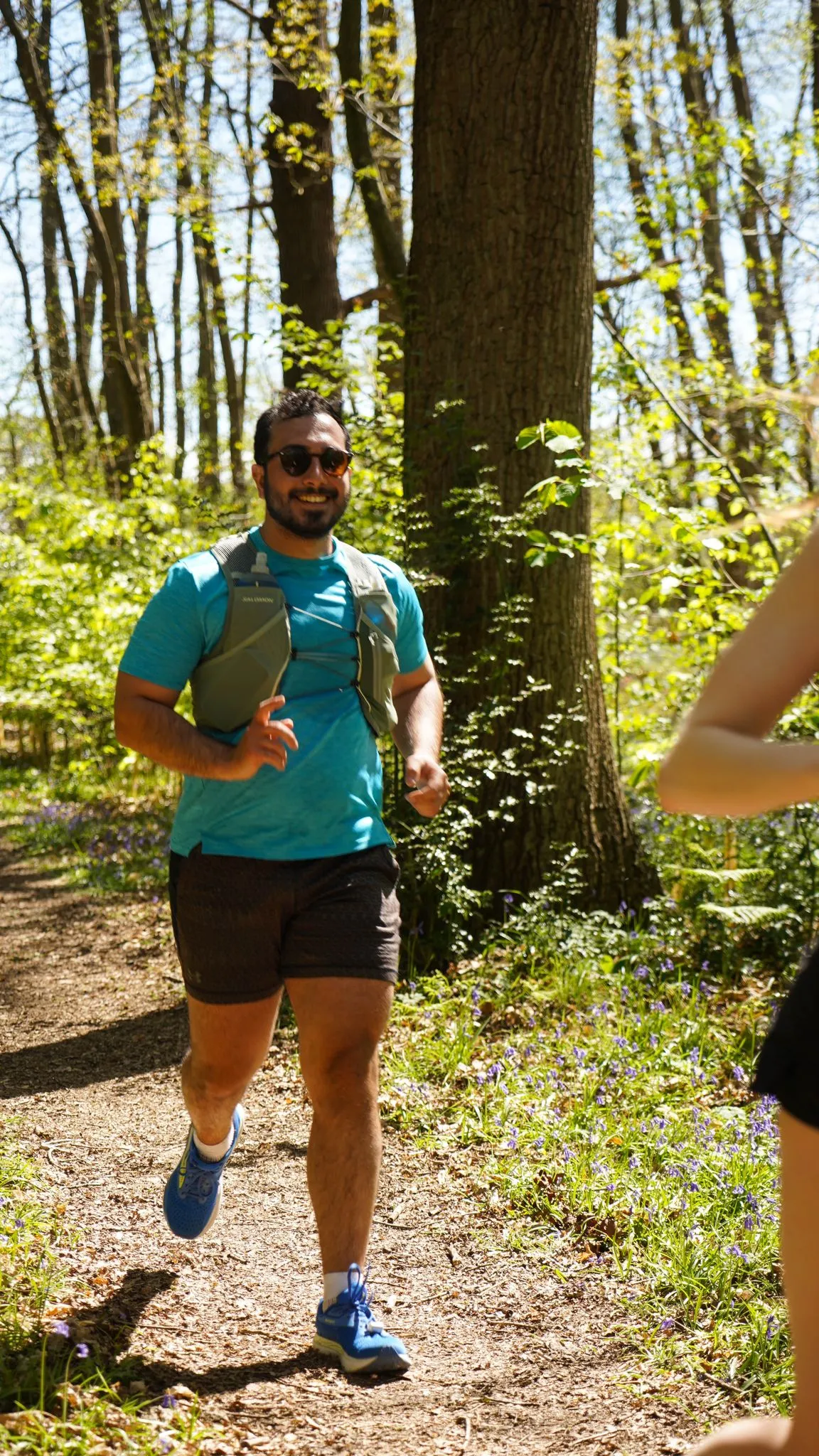 A runner on the bluebell woodland trail at Backyard Egg