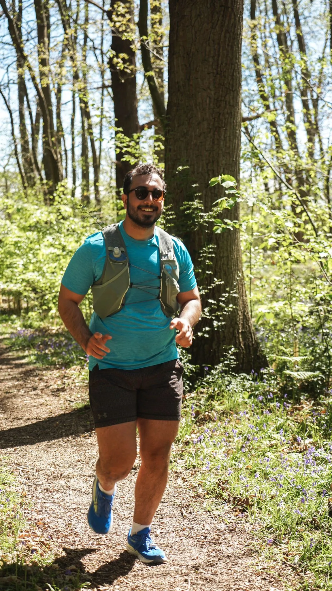 A runner on the bluebell woodland trail at Backyard Egg