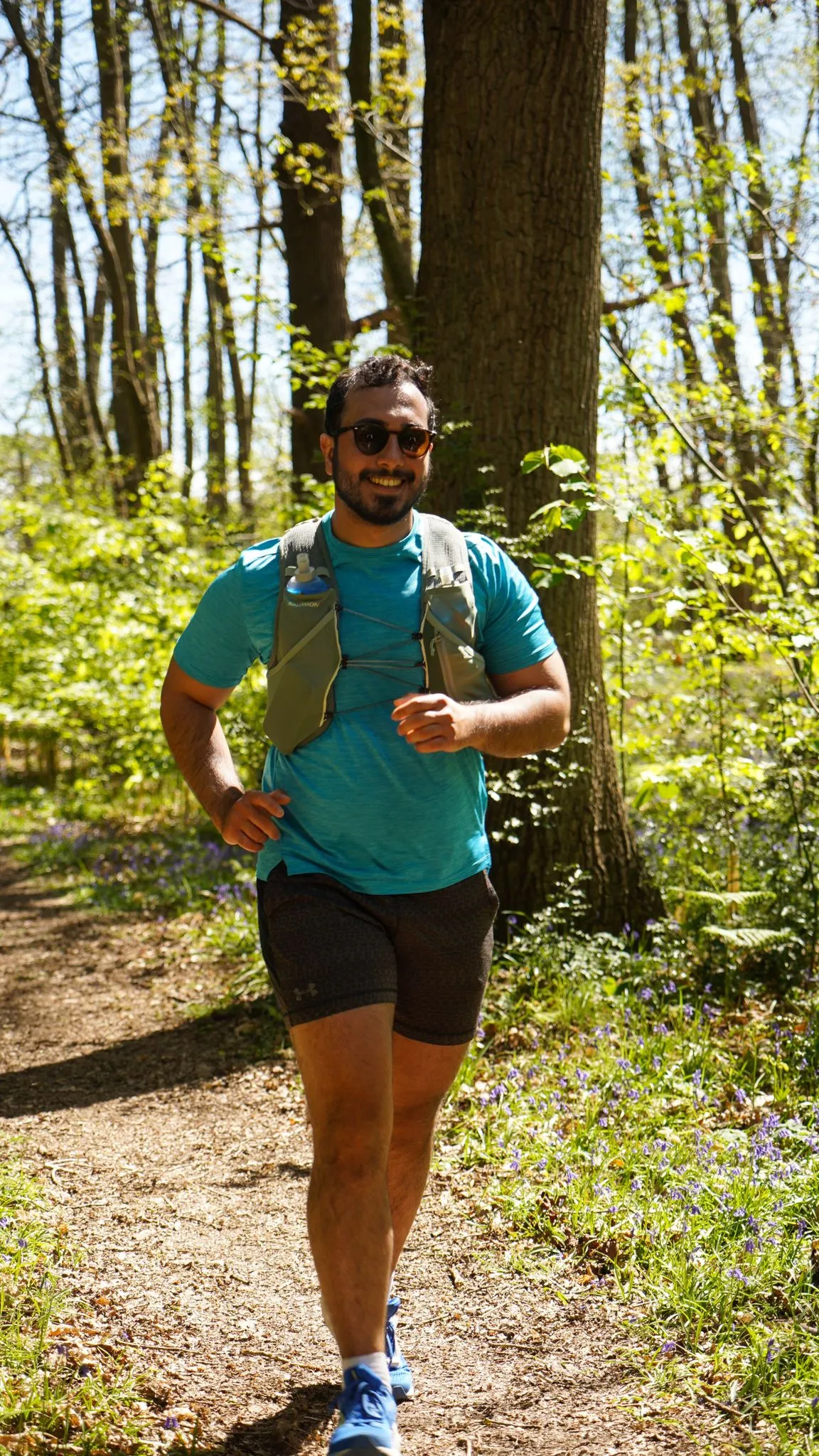 A runner on the bluebell woodland trail at Backyard Egg