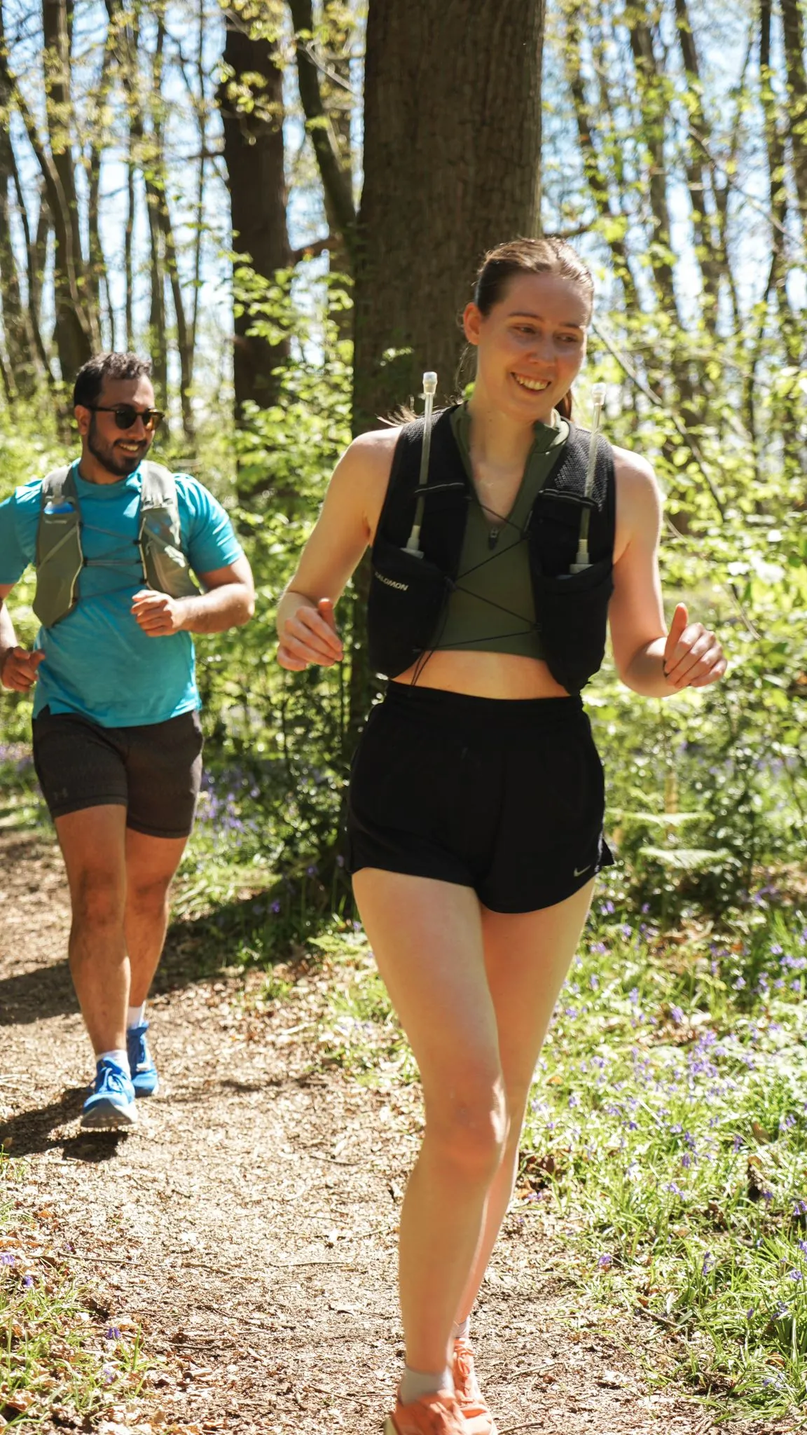A runner on the bluebell woodland trail at Backyard Egg