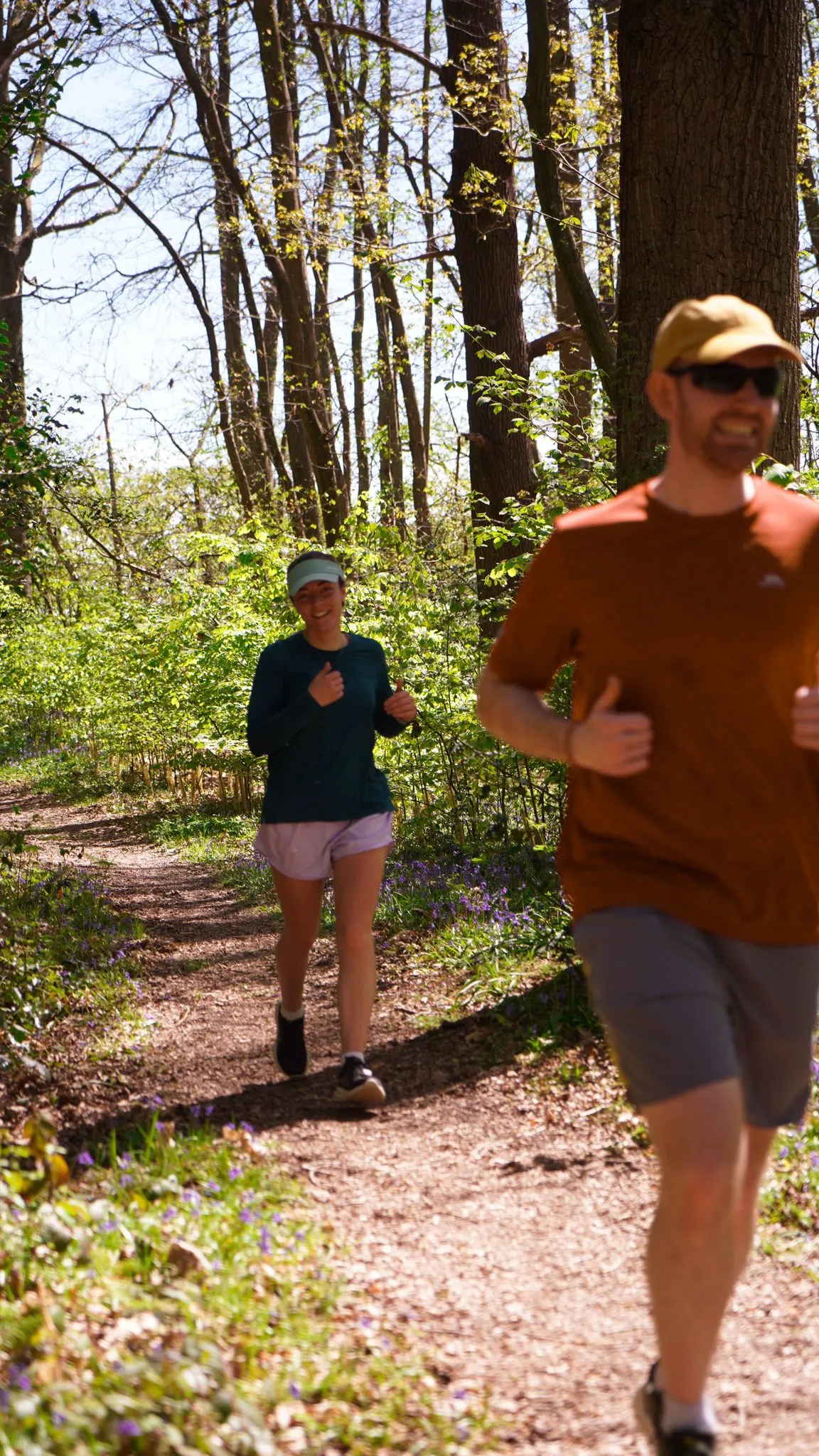 A runner on the bluebell woodland trail at Backyard Egg