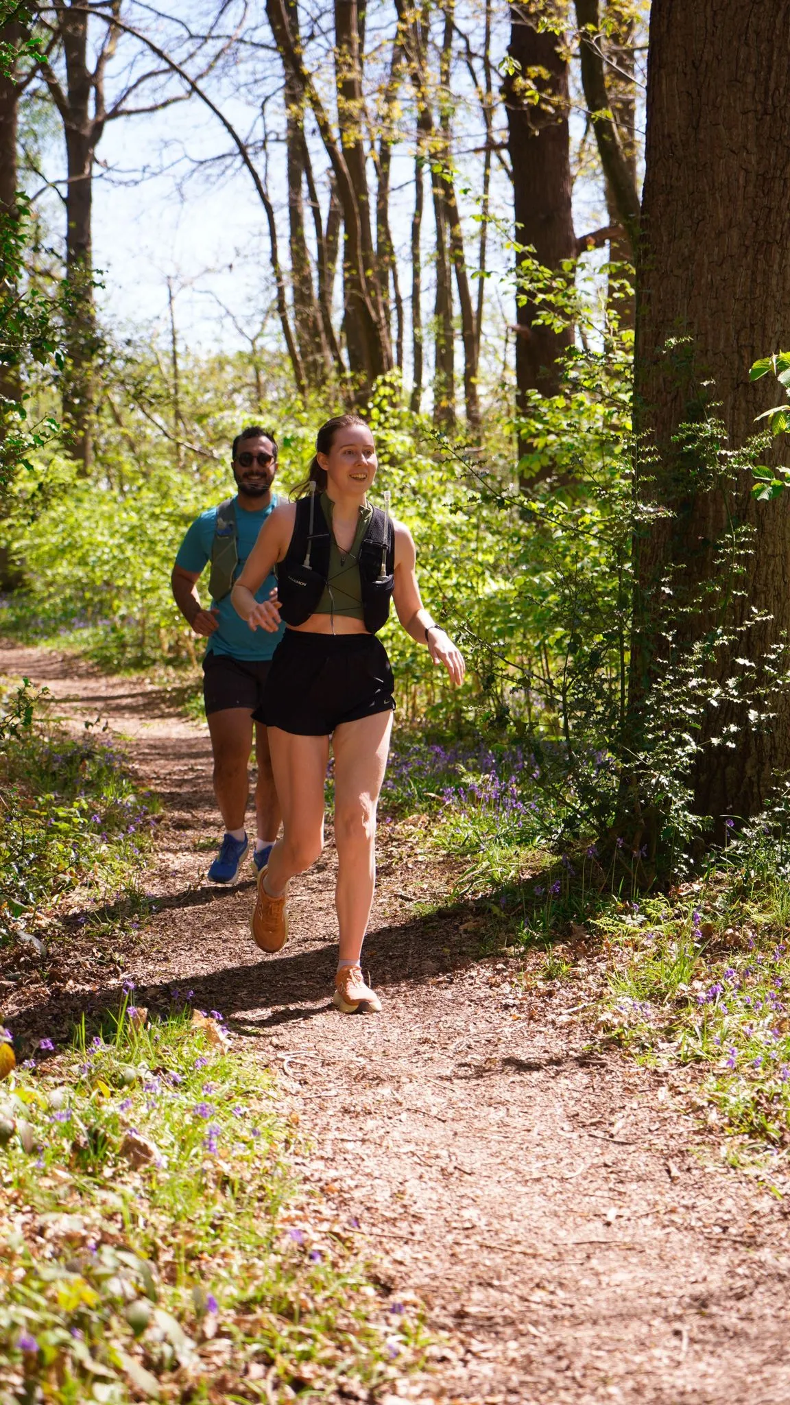 A runner on the bluebell woodland trail at Backyard Egg