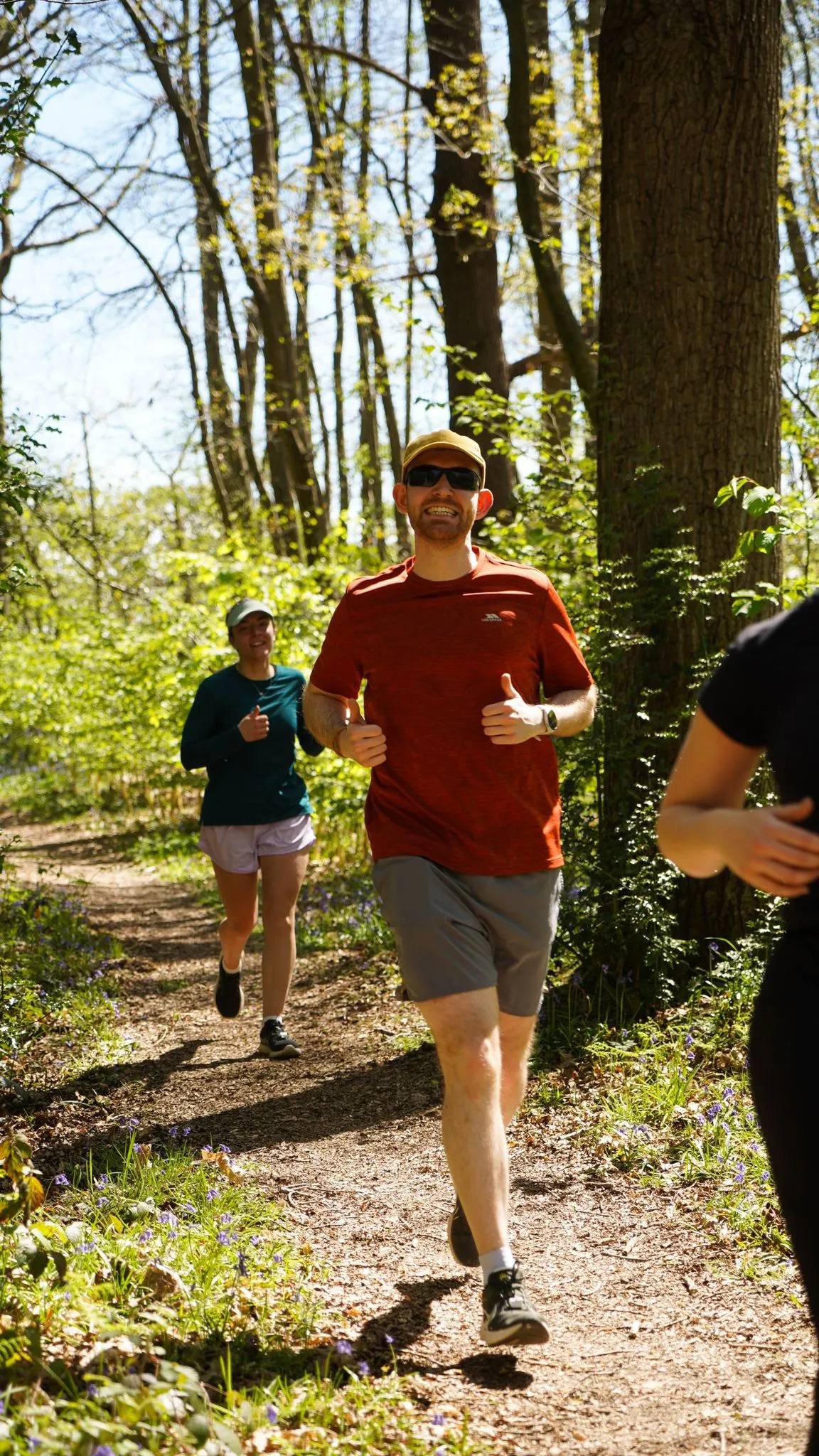 A runner on the bluebell woodland trail at Backyard Egg