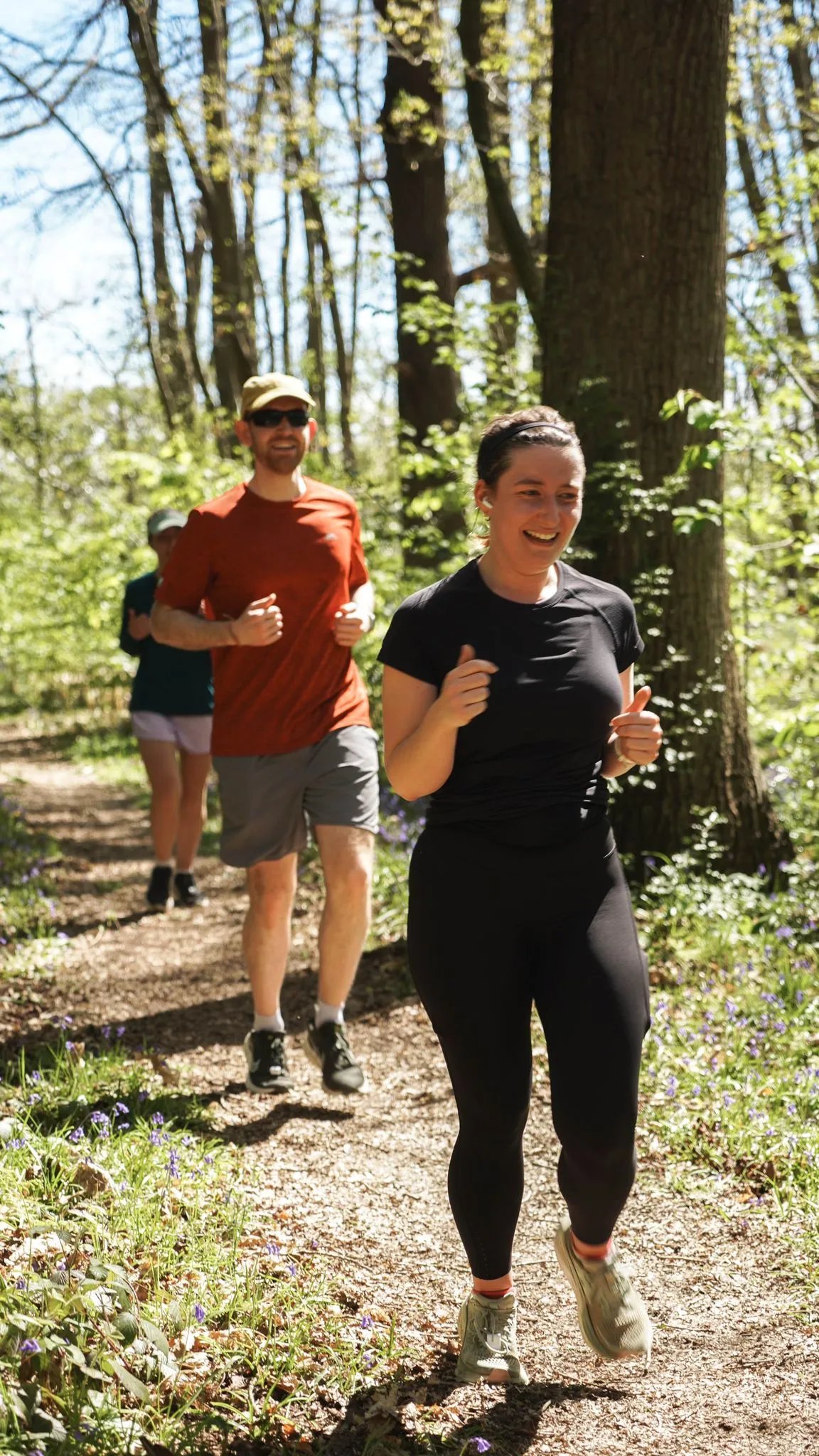 A runner on the bluebell woodland trail at Backyard Egg