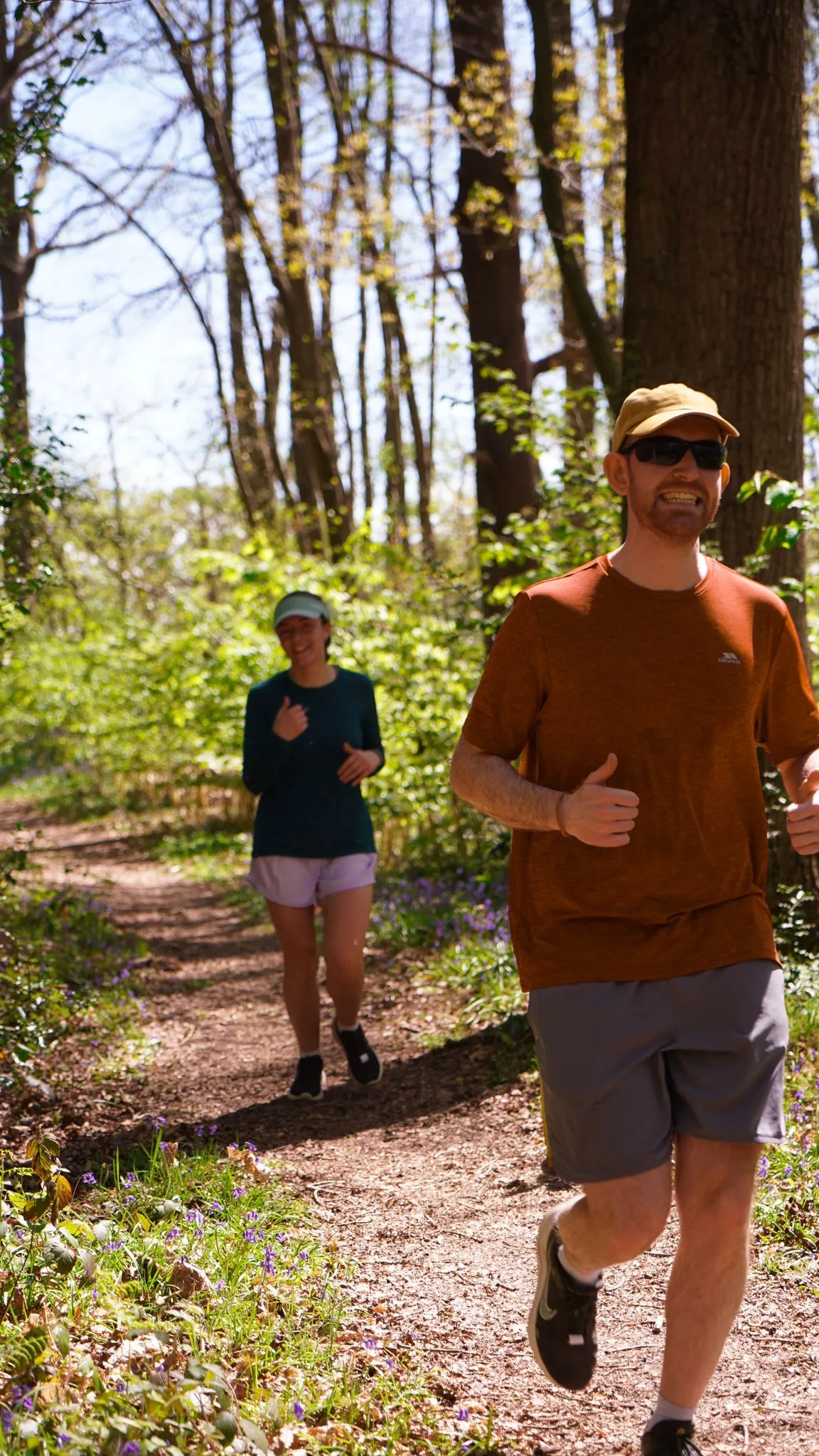 A runner on the bluebell woodland trail at Backyard Egg