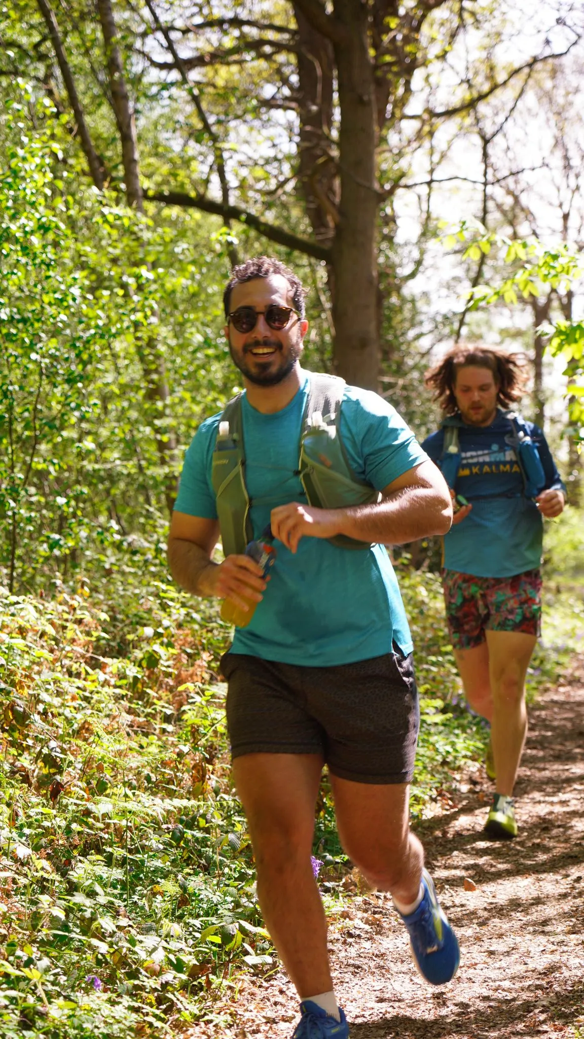 A runner on the bluebell woodland trail at Backyard Egg