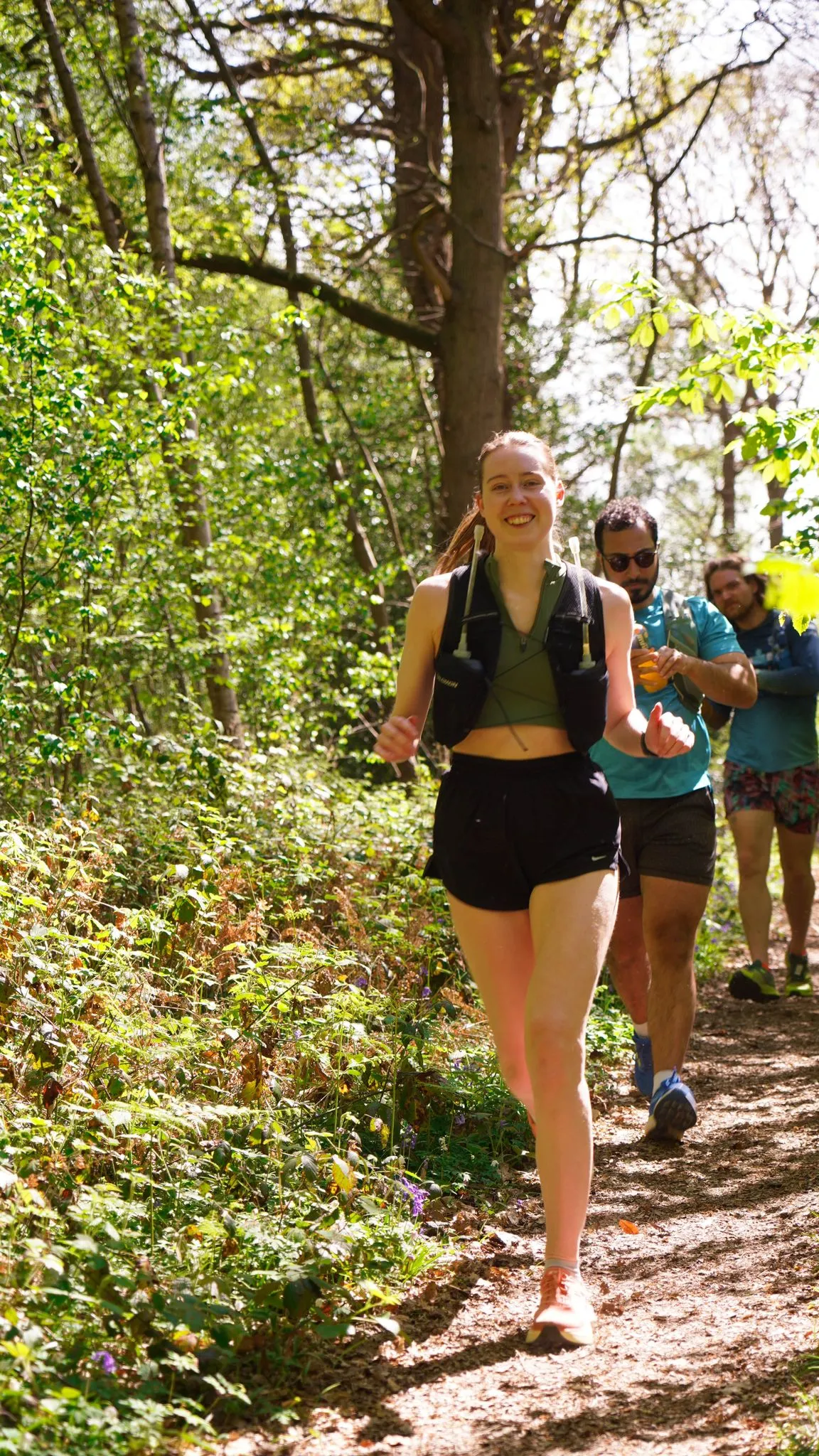 A runner on the bluebell woodland trail at Backyard Egg