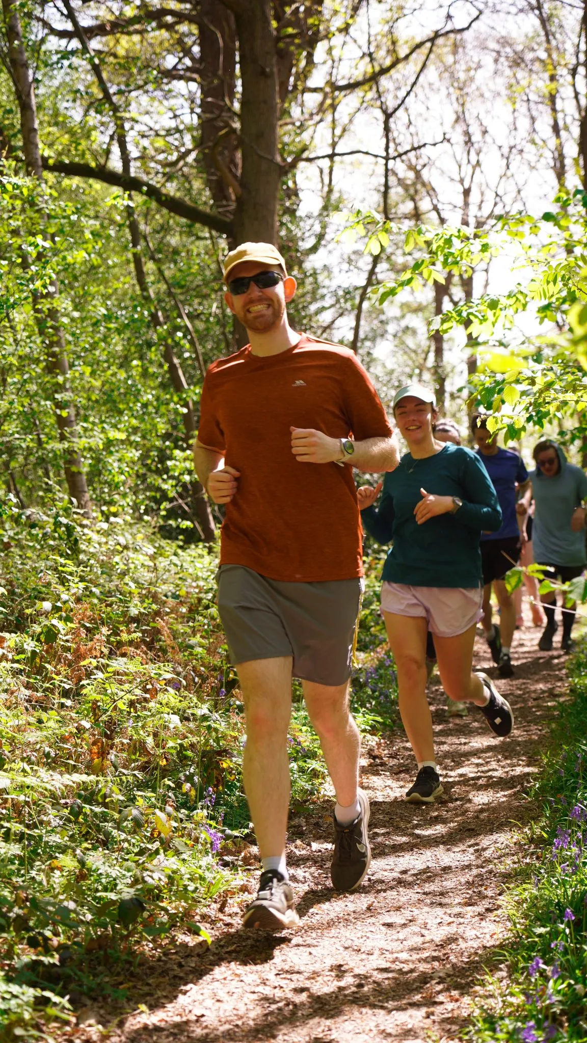 A runner on the bluebell woodland trail at Backyard Egg