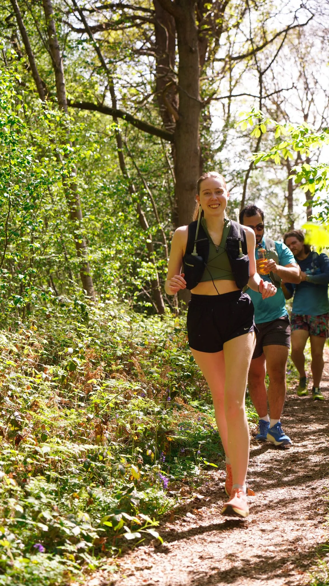 A runner on the bluebell woodland trail at Backyard Egg