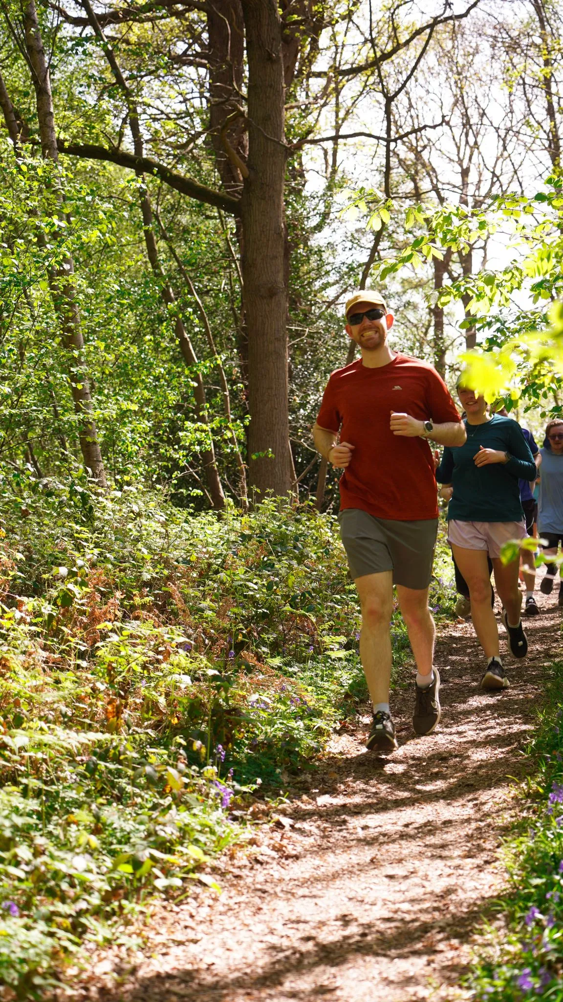 A runner on the bluebell woodland trail at Backyard Egg