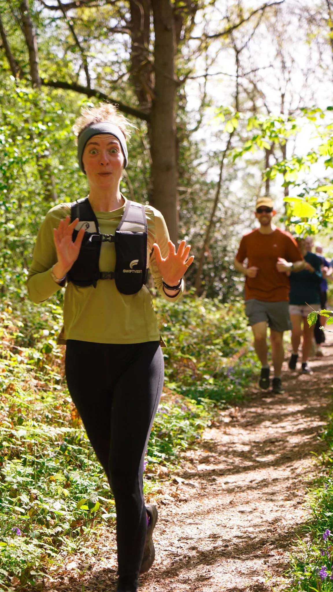 A runner on the bluebell woodland trail at Backyard Egg