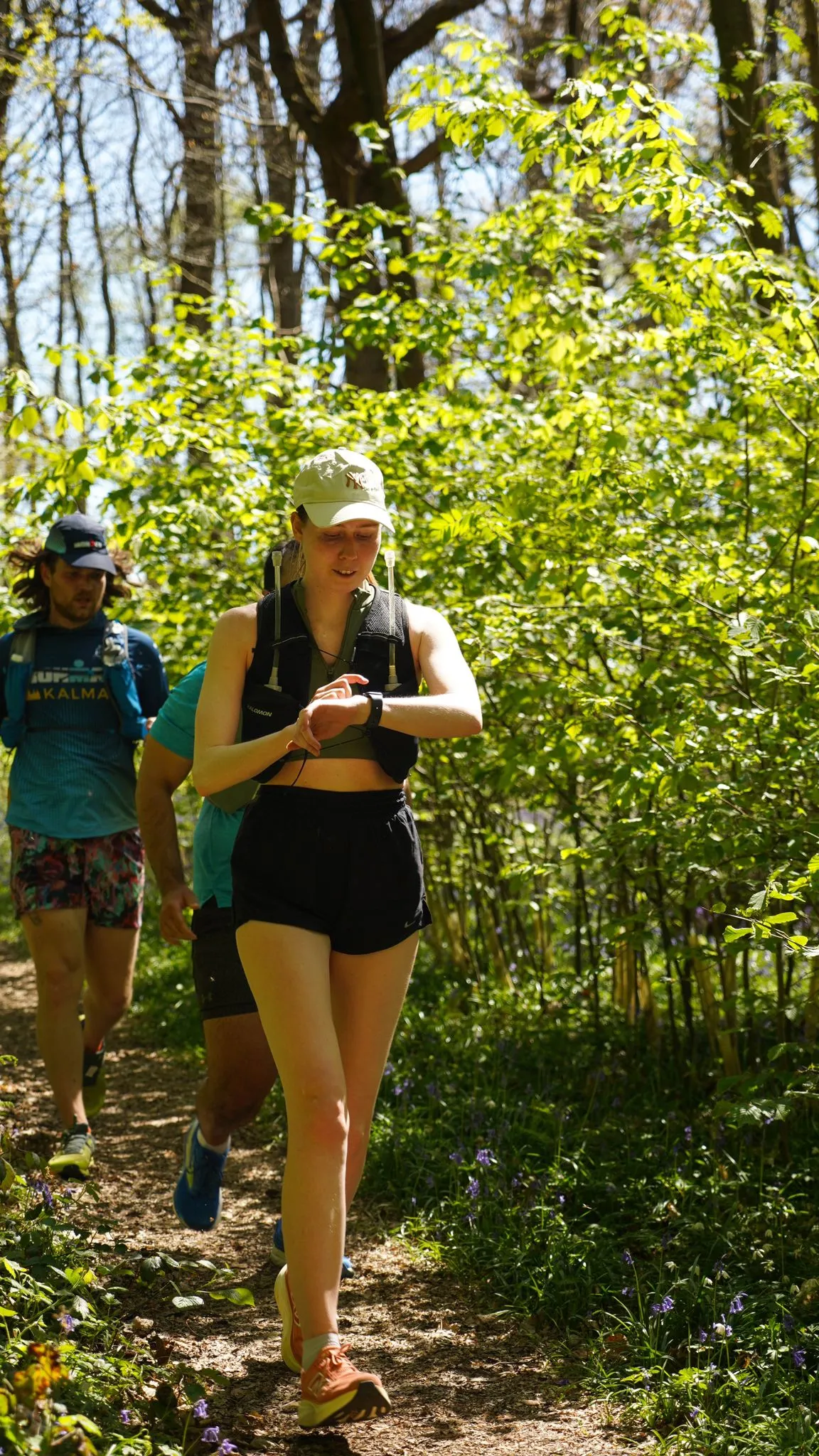 A runner on the bluebell woodland trail at Backyard Egg